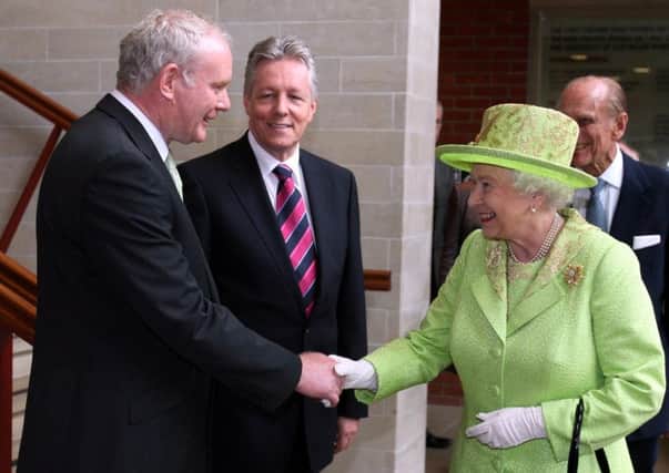 The Queen and Deputy First Minister Martin McGuinness shake hands in Belfast in 2012.