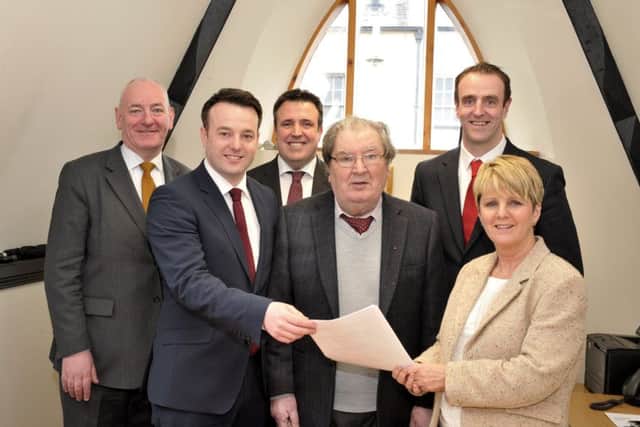Mark Durkan MP (on the left) and John Hume (centre) pictured with SDLP Assembly Elections candidates Colum Eastwood, Gerard Diver and Mark H. Durkan when they handed in their nomination forms to Deputy Returning Officer Patricia Murphy at the Electoral Office in Queen Street on Friday afternoon last. DER1416GS041
