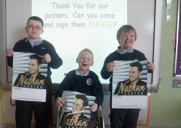 Kealan, Adrian and Matthew with Nathan Carter poster's sent to them by the star's management.