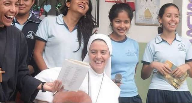St Clare pictured with some young people.