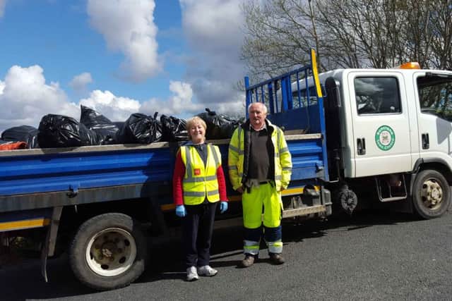 Councillor Rena Donaghey with Council Foreman George Porter with some of the rubbish collected in Buncrana