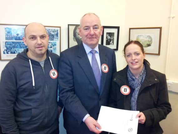 Foyle MP Mark Durkan supporting the local campaign by Emma and Darren Cowey from Tullyally, Derry, who lost their nine-month-old son Jamie to Men B in November 2004.
