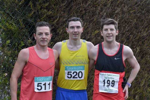 Conor Bradley (centre) winner of the Bay Road 5K Road Race on Wednesday evening last, with a time of 15 minutes and 13 seconds, pictured Danny Mooney (on the right) who finished second and Gary Slevin who took third place. DER1516GS026