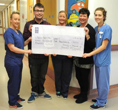 Sinead O'Connell and  her son Daniel recently visited the Unit to make their latest presentation of Â£3,500. Sister Allison Keys, Staff Nurse Louise McMacken and Staff Nurse Merissa McCrory accepted the donation on behalf of the Unit.
