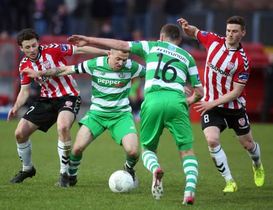 Derry's Barry McNamee and Harry Monaghan, pictured with
Shamrock Rovers' Gary McCabe and Patrick Cregg, were on top form last weekend.