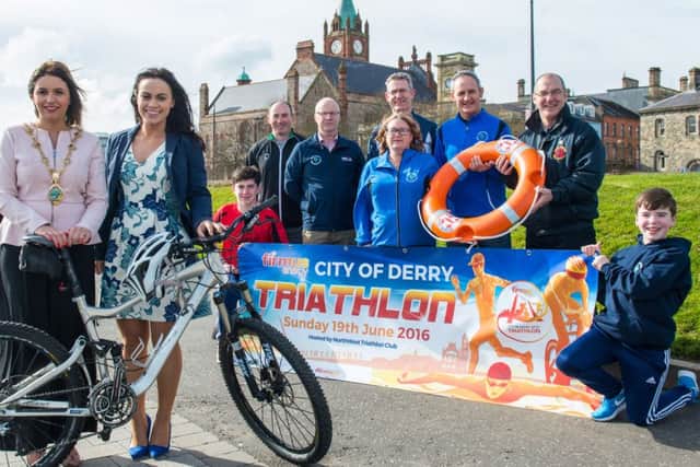 Mayor of Derry City and Strabane District Council, Cllr Elisha McCallion, helps Angeline Murphy of firmus energy launch the 2016 firmus energy City of Derry Triathlon which this year will take place on Sunday 19 June.  Also pictured are Eoin Taylor, Paddy McLaughlin, Triathlon Ireland,  Adrian Kelly, race director,  Noel Taylor, NWTC, Moira Glenn, NWTC, Paul McGilloway, NWTC, Pat Carlin, Foyle Search and Rescue and Ruairi Taylor