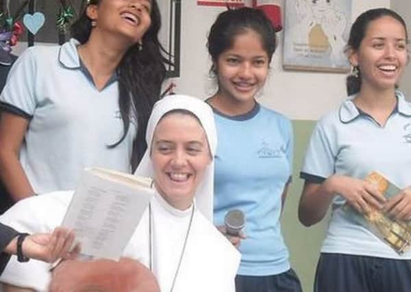 Sr Clare pictured with some young people.