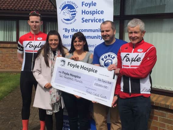 From left, James Behan, Secretary Foyle Cycling Club, Rachael Mullan, Trish Mullan and Mark Moroney, former Chairman of Foyle Cycling Club, present a cheque to Donal Henderson, Foyle Hospice (second from right) following the Adrian Mullan Sportive.