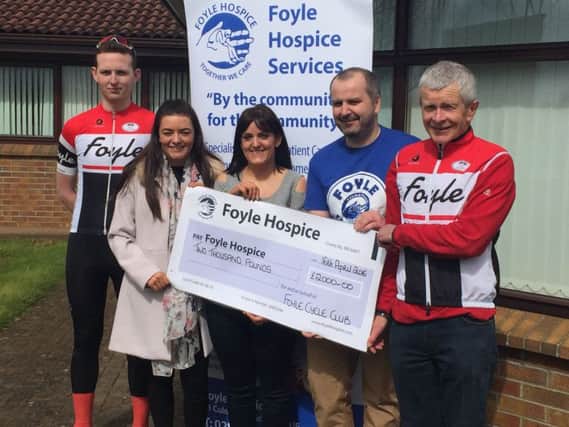 From left,  James Behan, Secretary Foyle Cycling Club, Rachael Mullan, Trish Mullan and Mark Moroney, former Chairman of Foyle Cycling Club, present a cheque to Donal Henderson, Foyle Hospice (second from right) following the Adrian Mullan Sportive.
