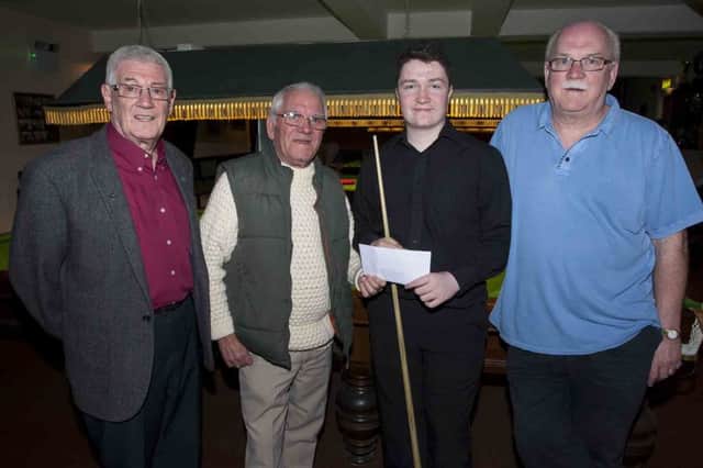 Jimbo Crossan, AOH, pictured on Wednesday night presenting a sponsorship cheque to Shea Moore, who is off to represent Ireland in the Home Internationals Snooker next week. Included in photo are Seamus Fleming, AOH, and Martin Moore, Shea's grandfather. DER1516MC006