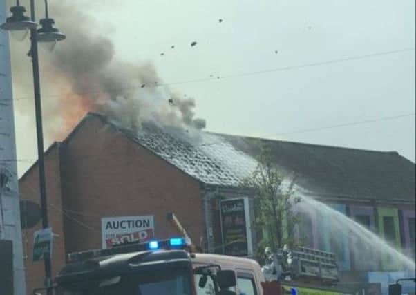 Fire-fighters tackling the blaze at Rainbow Chinese restaurant and take away on Sunday.