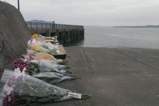 Numerous floral tributes were placed at Buncrana pier following the tragedy in March.