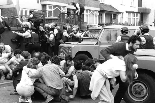 Anniversary of Internment march to Andersonstown at which banned Noraid man Martin Galvin appeared in August, 1984. The RUC moved in on the crowd as soon as Galvin got onto the platform at the Sinn Fein centre. They fired plastic bullets and used batons to clear the crowd. Several were seriously injured by plastic bullets and Sean Downes, seen here lying on the ground was killed.