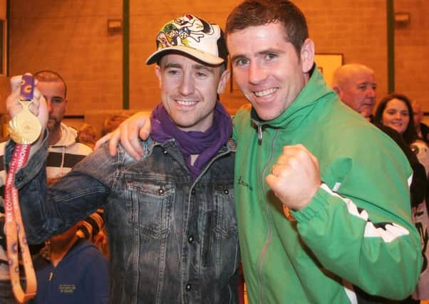 Eamonn O'Kane with Paul McCloskey following his Commonwealth games Gold medal win in 2010.