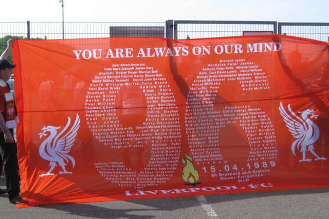 'You Are Always On Our Mind' - a large banner featuring the names of the Liverpool fans who lost their lives is held aloft.