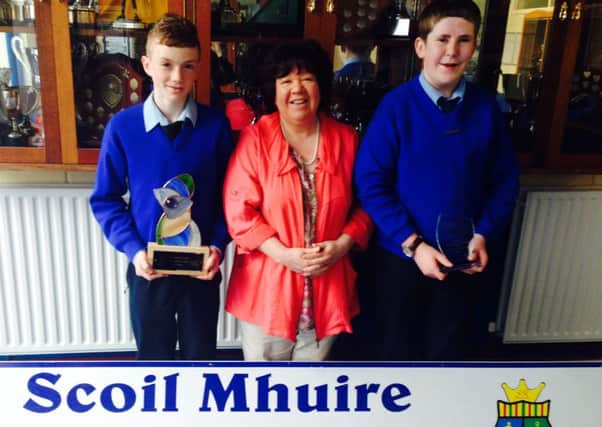 Sean Og and Oisin pictured with Scoil Mhuire Principal Ms Rosaleen Grant.
