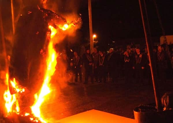 Apprentice Boy's Parade Brethern watch as the Effigy of Lundy is burned