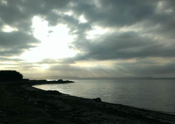 Sun struggling through the clouds at Quigley's Point this week.