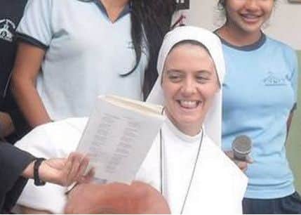 Sr Clare pictured with some young people.