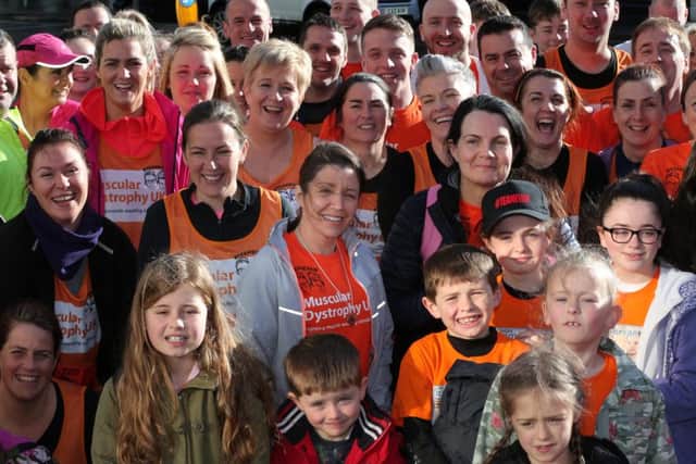 Louise James pictured with runners from Derry who come together to take part in the Belfast marathon.