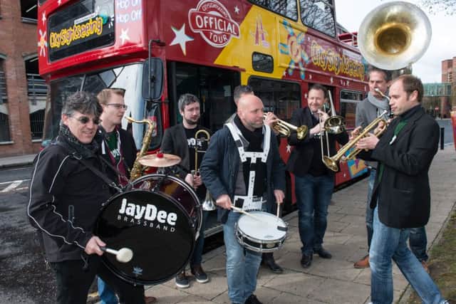 The Jaydee Brass Band who have made a welcome return  for this years City of Derry Jazz and Big Band Festival, make their way through the city cente on an opentop bus. The festival, organised by Derry City and Strabane District Council, features live music  at 70 venues with over 200 acts performing over the Bank Holiday weekend. Full details are available at www.cityofderryjazzfestival.com. Picture Martin McKeown. Inpresspics.com. 28.04.16c