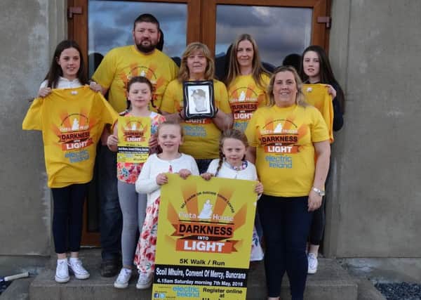 Daniel McEleney's mum Mena, (centre), his siblings and extended family members will take part in Darkness Into Light.