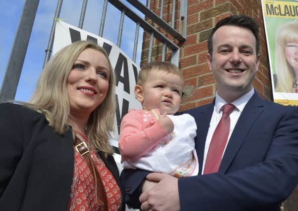 The SDLP leader Colum Eastwood with his wife Rachel and daughter Rossa arriving at the Model School Polling Station on Academy Road. DER1816GS059