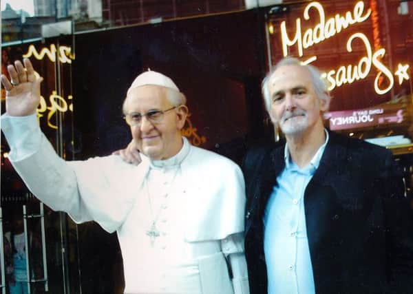 Derry man Brian Doherty pictured beside a model of Pope Francis outside Madame Tussauds in New York.