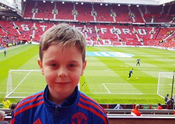 Less than one hour after this photo was taken eight year-old Kian Dawson and his dad Emmett Kirk were evacuated from Old Trafford. It was Kian's first ever time seeing his beloved 'Red Devils'.