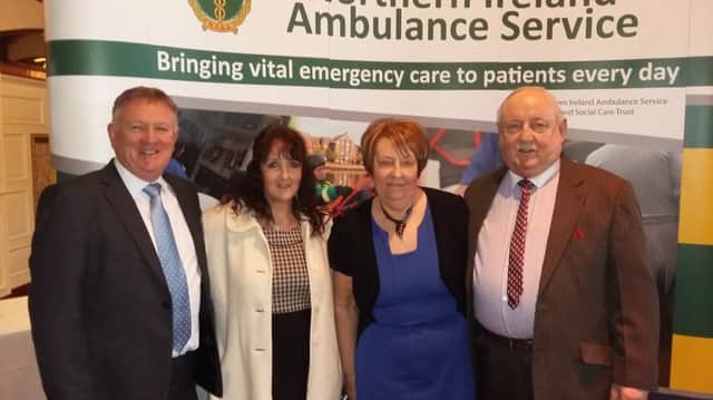 Ivan Simpson (left)  and his wife Heather pictured with Maurice and Maud Simpson at a special event in the Balmoral Hotel recognising their service to the Northern Ireland Ambulance Service.