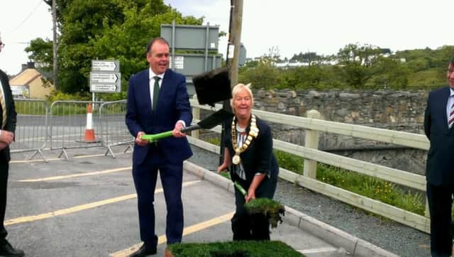 Minister Joe McHugh and Mayor of Buncrana Rena Donaghey cutting the sod at Cockhill.