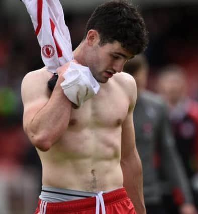 A dejected Danny Heavron of Derry leaves the field after the game with a Tyrone shirt during the Ulster GAA Football Senior Championship, Quarter-Final, at Celtic Park, Derry.  Photo by Oliver McVeigh/Sportsfile