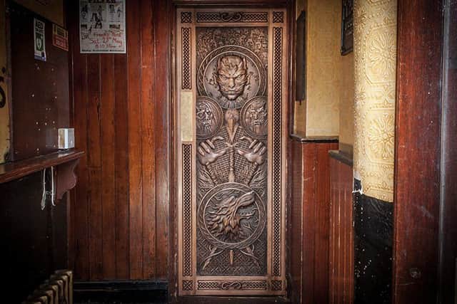 The intricately carved door which depicts scenes from episode five of series six  a feature of Tourism Irelands new Game of Thrones campaign  which will hang in Frank Owens Bar in Limavady. Pic: Tourism Ireland
