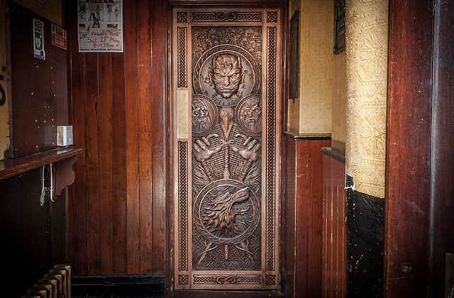 The intricately carved door which depicts scenes from episode five of series six  a feature of Tourism Irelands new Game of Thrones campaign  which will hang in Frank Owens Bar in Limavady. Pic: Tourism Ireland