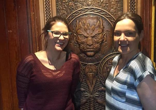 Game of Thrones fans, (l-r) Rebecca King from Strabane and Faye Ferguson from Limavady in Frank Owens bar in Limavady beside the 'Door of Thrones'.