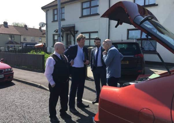 From the left are Daniel Bradley the next of kin of Seamus Bradley pictured at Linsfort Drive in Creggan on Tuesday in discussion with barrister David Heraty, solicitor Richard Campbell of Quigley, Grant and Kyle and the independent ballistics expert commissioned to carry out the tests at the scene of the killing.