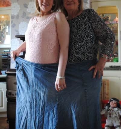 Geraldine and her daughter Carole inside the size 32 skirt that she once struggled to get on.