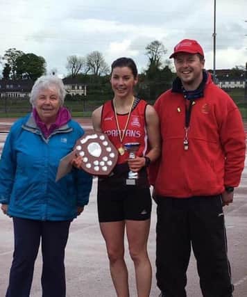 City of Derry's Angeline McShane, winner of Paddy O'Donnell Female 800m race, with Paddy's wife Mary and son, Martin O'Donnell.