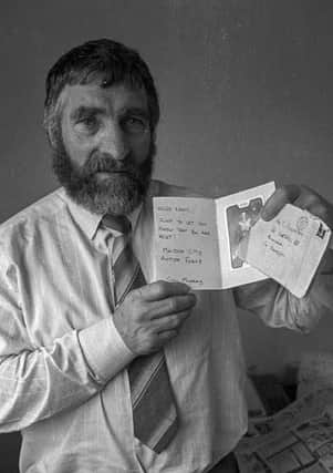 The late Cllr. Eddie Fullerton pictured with a death threat which was posted to his home in Buncrana in Co. Donegal before his death. Photo Brian Mc Daid