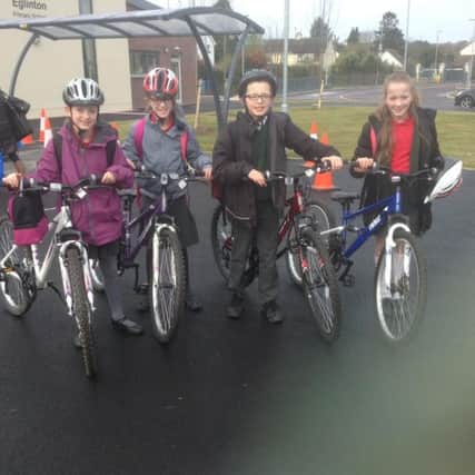 The Somerville Quadruplets, pupils at Eglinton Primary School, with their bikes.