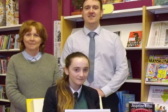 St. Patrick's College, Dungiven student, Yr 9 pupil Sophia Carlisle at the Accelerated Reader presentation with School Librarian Mrs McCloskey and Literacy Coordinator Mr Barr.