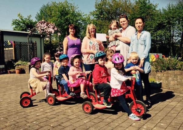 The Galliagh Nursery teachers and kids.