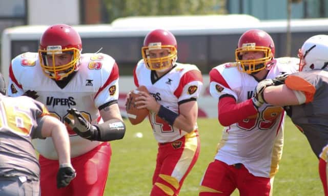 Vipers Quarterback, Nic Young has plenty of time to complete the touchdown pass as Christoper O'Doherty and Shaun McGrory protect the pocket.
