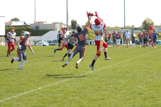 The Vipers' Eugene McLaughlin leaps to catch a precision pass.