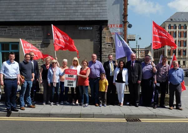 People pictured at strike outside of the Electoral Office in Derry on Friday.