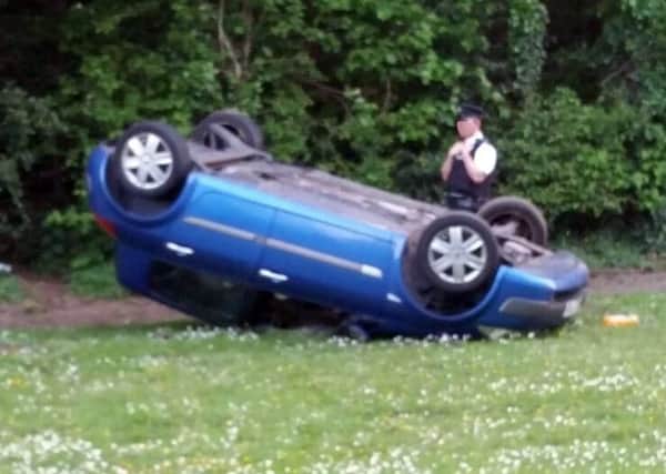 The overturned car on the Creggan Road on Sunday. (Photo: Sean Campbell Photography)