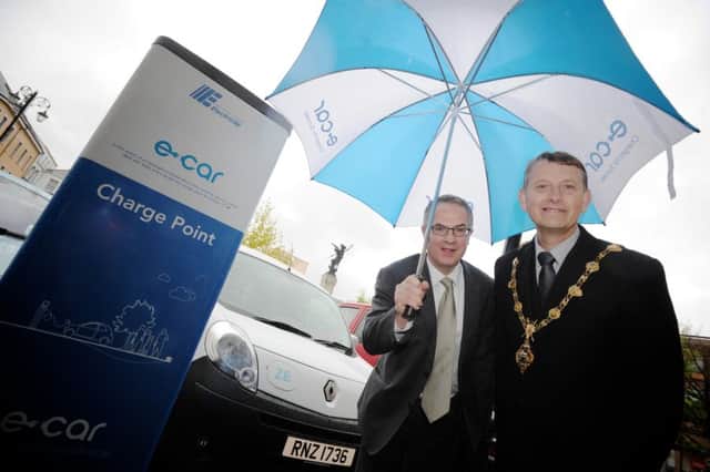 Back in 2012 the then Mayor of Derry, Alderman Maurice Devenney, joined the Environment Minister at the time, Alex Atwood at the launch fo the Electric car charging point in the Diamond, Derry.
