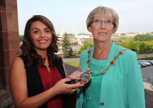 Colr. Elisha McCallion pictured handing over the Mayoral Chain to new Mayor of Derry and Strabane Alderman Hilary McClintock. Photo: Lorcan Doherty Photography