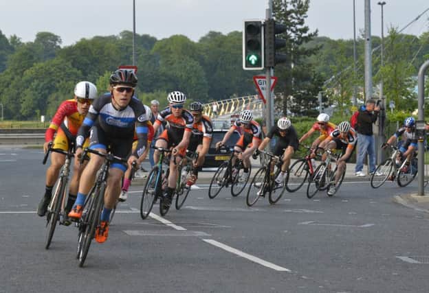 Competitors making their way towards Shipquay Street during Tuesday evenings Maiden City Criterium Cycle A1/2/3 Race. DER2316GS021