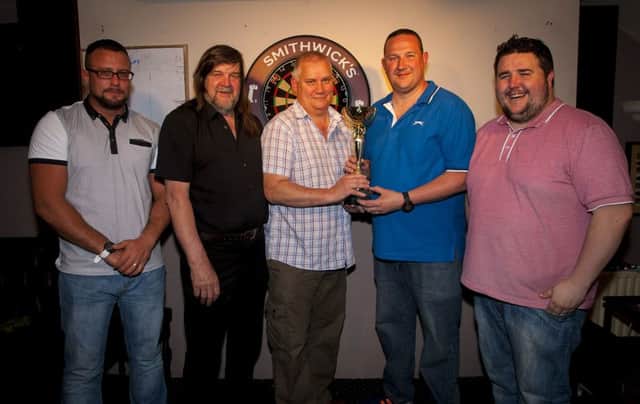 MAILEY'S DARTS CUP. . . . .Philip Oakes, Chair, North West Darts League presenting the Mailey's Cup to James Clancy, Mailey's Bar, winners on Friday night last. Included are team captains, Artie Stewart, Cosh Bar, Anthony Newtown, Carraig Bar and Stacy Din Ramsey, Brandywell Bar. DER2316MC003